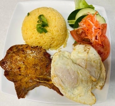 Grilled Pork Chop with 2 Eggs with Butter Rice.